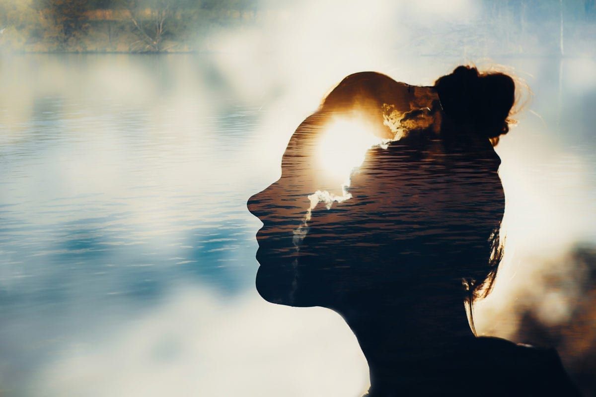 Image of water with overlay of woman's silhouette