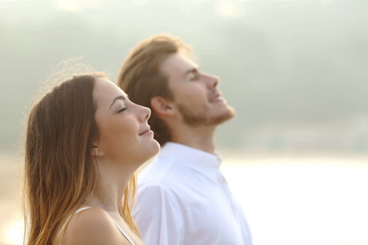 Image of two people breathing in