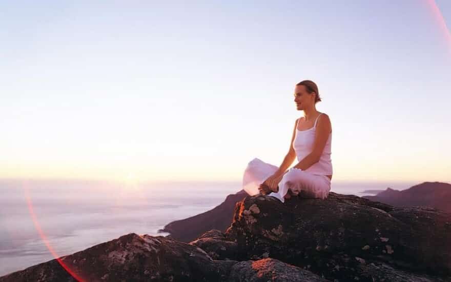 Image of woman sitting on rocks
